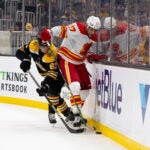 Jakub Zboril #67 of the Boston Bruins checks Milan Lucic #17 of the Calgary Flames during the second period at the TD Garden on November 21, 2021 in Boston, Massachusetts. The Flames won 4-0.