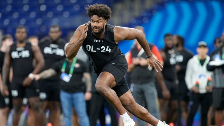 Ohio State offensive lineman Paris Johnson Jr. runs a drill at the NFL football scouting combine in Indianapolis, Sunday, March 5, 2023.