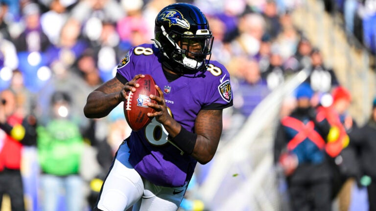 Ravens quarterback Lamar Jackson looks to pass the ball