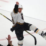 Boston Bruins right wing David Pastrnak (88) celebrates his game-winning goal in overtime.