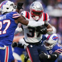 Buffalo Bills cornerback Tre'Davious White (27) and safety Jordan Poyer (21) tackle New England Patriots running back Damien Harris (37) during the second half of an NFL football game Sunday, Jan. 8, 2023, in Orchard Park, N.Y.