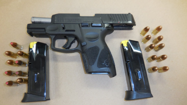 A loaded 9mm Taurus GC3 handgun along with an additional loaded magazine.