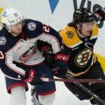 Jake Christiansen collides with Bruins left wing Tyler Bertuzzi.