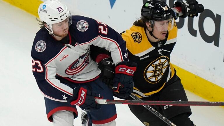 Jake Christiansen collides with Bruins left wing Tyler Bertuzzi.