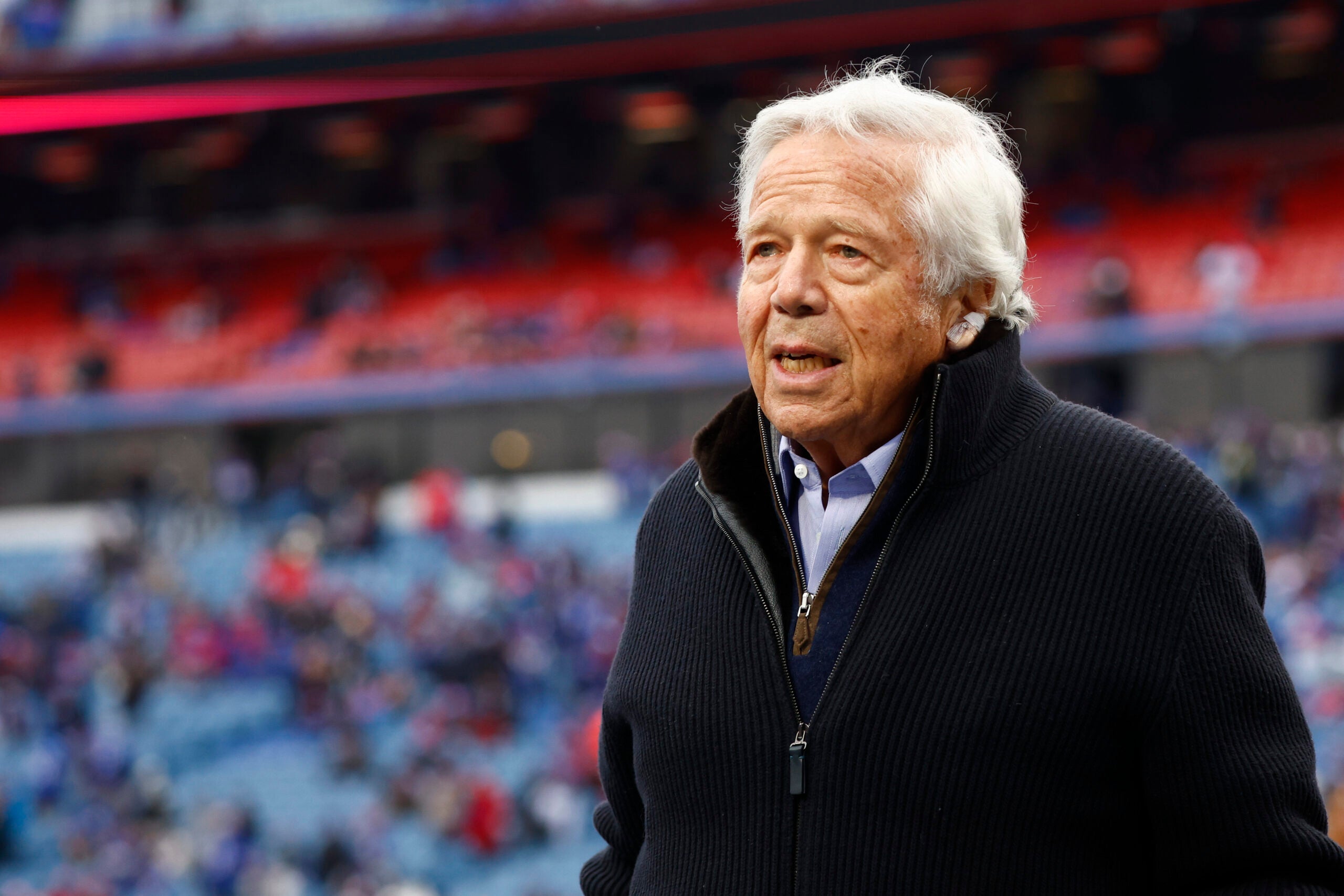 New England Patriots owner Robert Kraft walks the field during practice before an NFL football game against the Buffalo Bills, Sunday, Jan. 8, 2023, in Orchard Park, N.Y