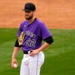 Colorado Rockies relief pitcher Daniel Bard is pulled from the game with a bloodied hand.