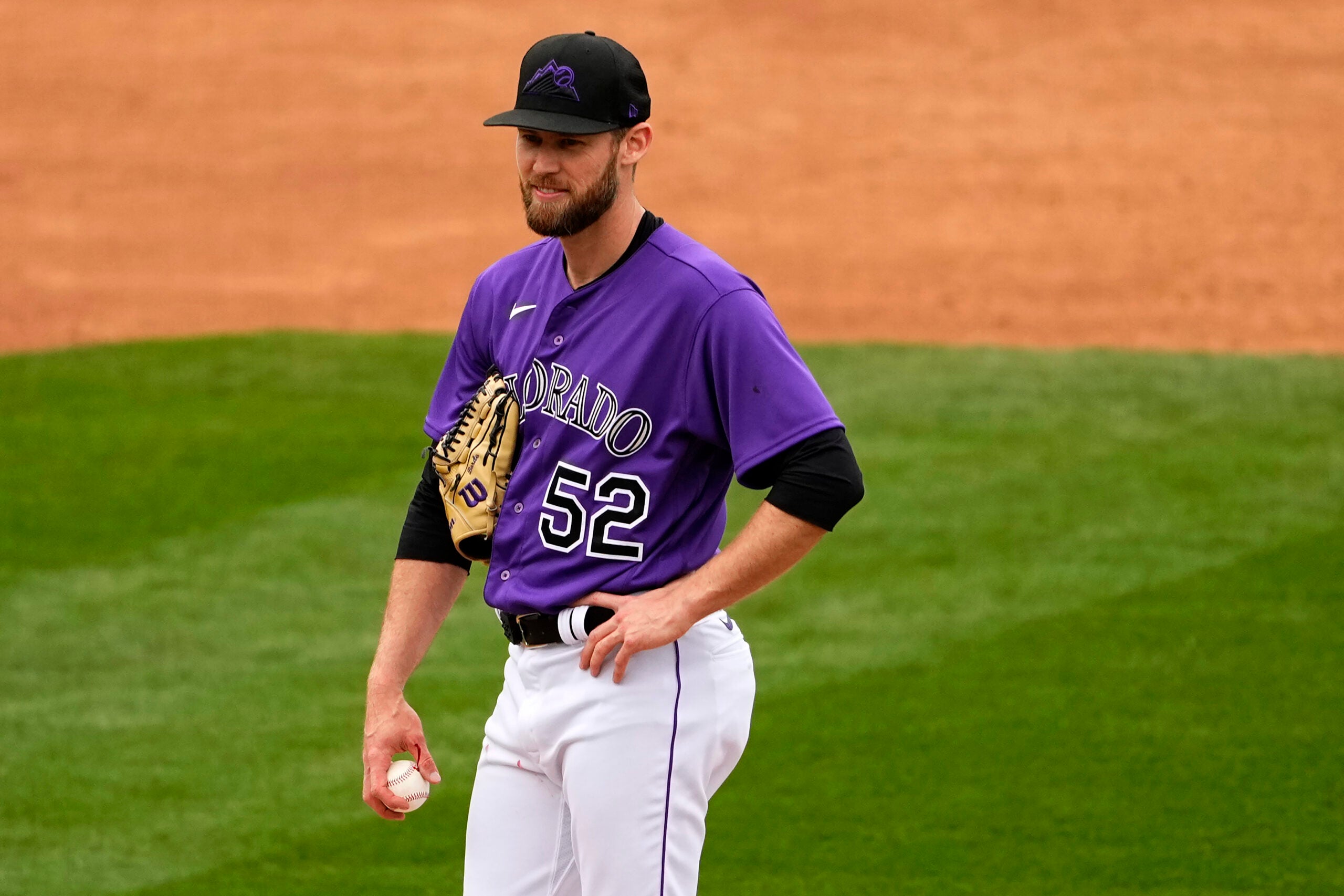 Colorado Rockies relief pitcher Daniel Bard is pulled from the game with a bloodied hand.