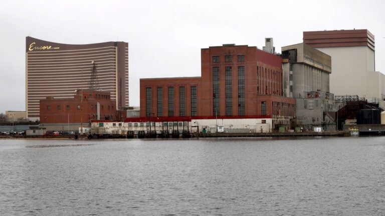 The old Mystic Generating Station in Everett, with Encore Boston Harbor casino in the background.