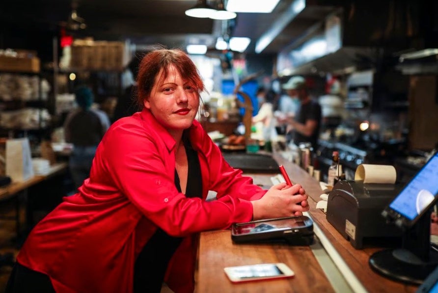 Co-owner Rebecca Kean stands for a portrait in the dining area of Brassica Kitchen + Cafe in Jamaica Plain on Jan. 10, 2021.