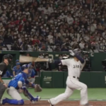 Masataka Yoshida hits a home run for Japan in the World Baseball Classic