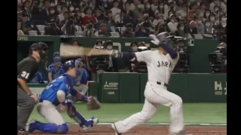 Masataka Yoshida hits a home run for Japan in the World Baseball Classic