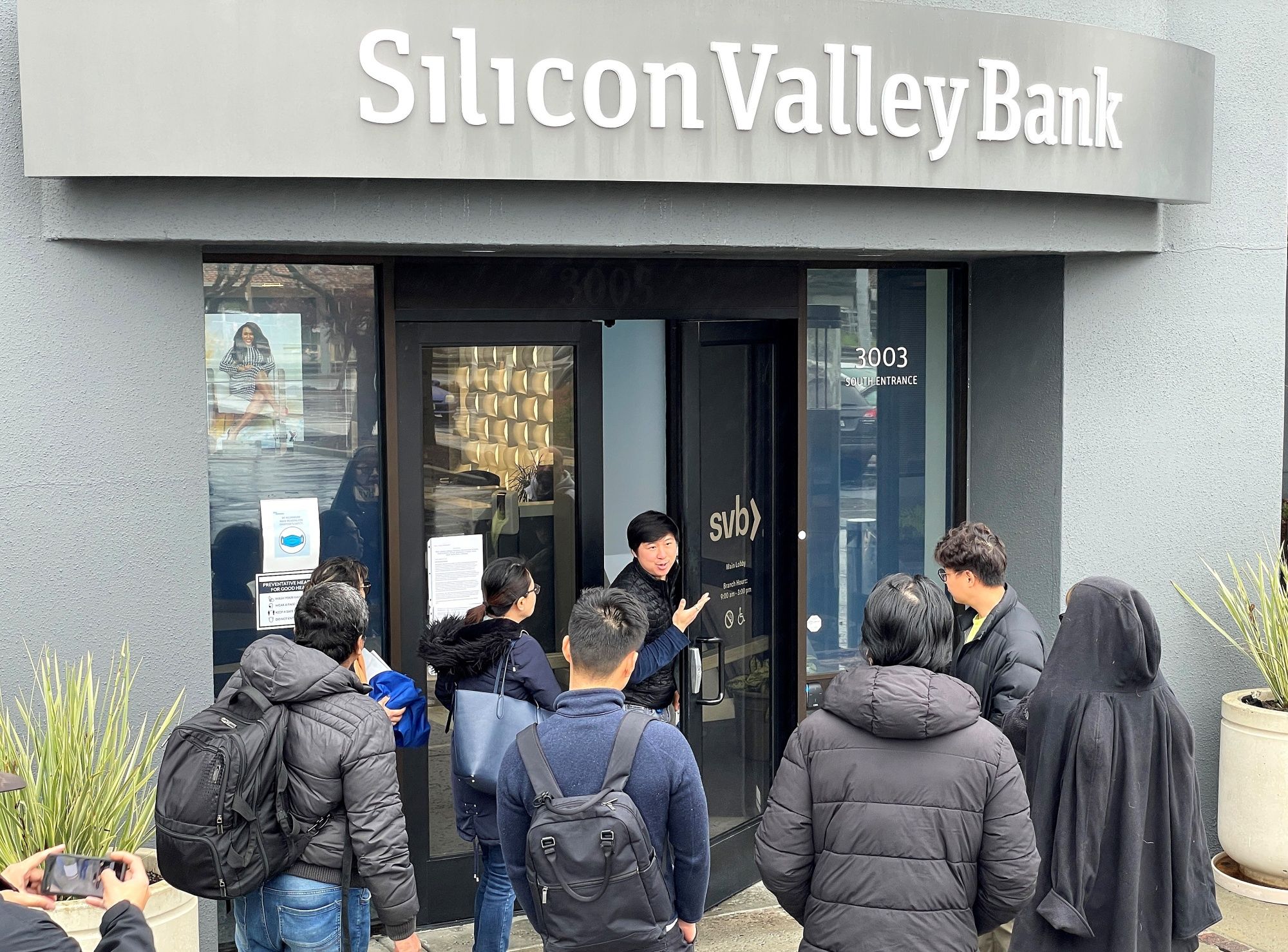 People are told the Silicon Valley Bank (SVB) headquarters is closed.