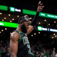 Boston Celtics guard Jaylen Brown acknowledges cheers from the crowd in the second half of an NBA basketball game against the San Antonio Spurs, Sunday, March 26, 2023, in Boston.