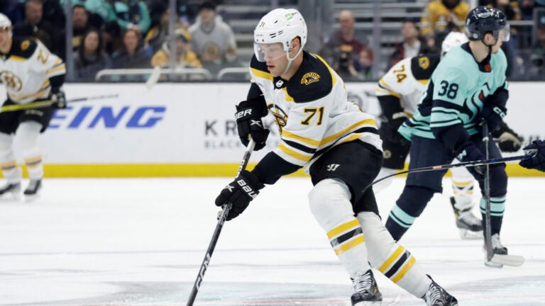 In a playoff-like atmosphere, Bruins win a wild one against the Maple Leafs  on Matt Grzelcyk's late goal - The Boston Globe