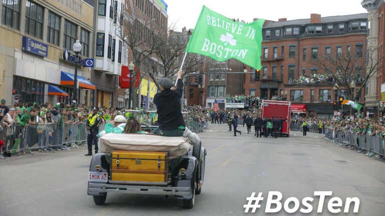 Griffin Rogers waving a Boston Flag during the 2022 South Boston’s St. Patrick’s Day Parade.