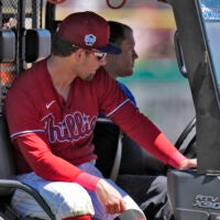 Rhys Hoskins is carted off of the field in spring training.