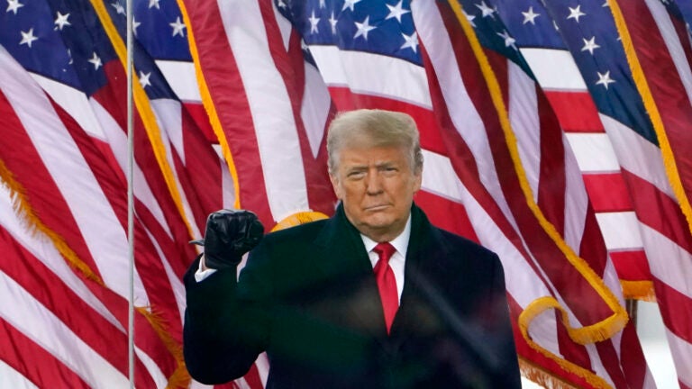 President Donald Trump gestures as he arrives to speak at a rally in Washington, Jan. 6, 2021.