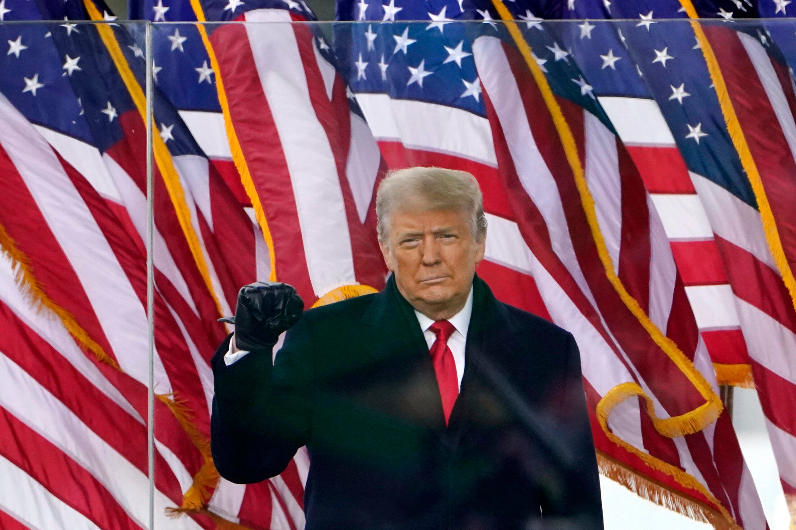 President Donald Trump gestures as he arrives to speak at a rally in Washington, Jan. 6, 2021.