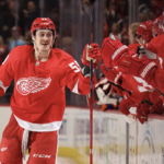 Tyler Bertuzzi #59 of the Detroit Red Wings celebrates his first period goal with teammates while playing the Edmonton Oilers at Little Caesars Arena on February 07, 2023 in Detroit, Michigan.
