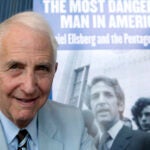 alt = Daniel Ellsberg, in a shirt and tie, speaks during an interview in Los Angeles on Sept. 23, 2009.
