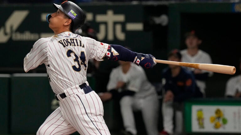 Masataka Yoshida hitting for team Japan in the World Baseball Classic.
