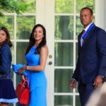 Tiger Woods walking with his daughter Sam Alexis Woods and his girlfriend Erica Herman.
