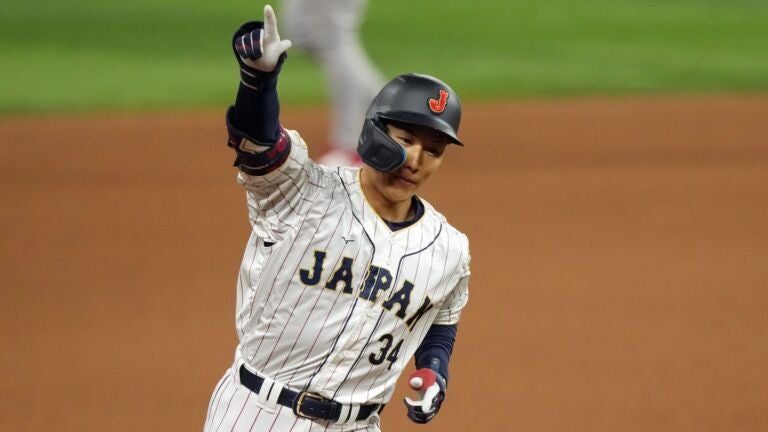 Masataka Yoshida #34 of Team Japan rounds the bases after hitting a three-run home run in the seventh inning against Team Mexico to tie the World Baseball Classic Semifinals at loanDepot park on March 20, 2023 in Miami, Florida.