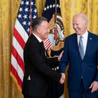 President Joe Biden presents Bruce Springsteen with a National Medal of Arts medal during a ceremony in the East Room at the White House on Tuesday.