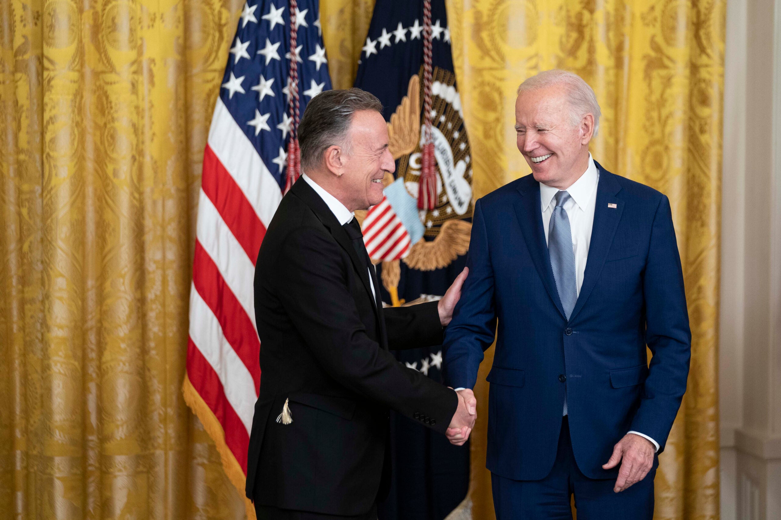 President Joe Biden presents Bruce Springsteen with a National Medal of Arts medal during a ceremony in the East Room at the White House on Tuesday.