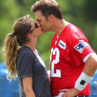 Tom Brady kisses his wife Gisele Bundchen after a 2018 practice