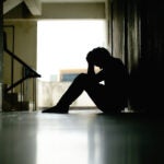 Silhouette of depressed man