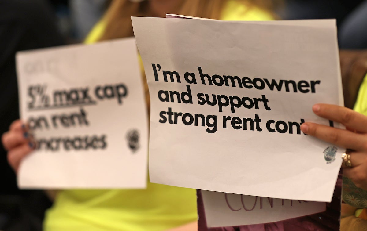 Support signs at Boston City Hall during a listening session on the Rent Stabilization Home Rule Petition.