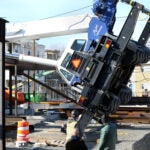 alt = a toppled over crane in Chelsea.