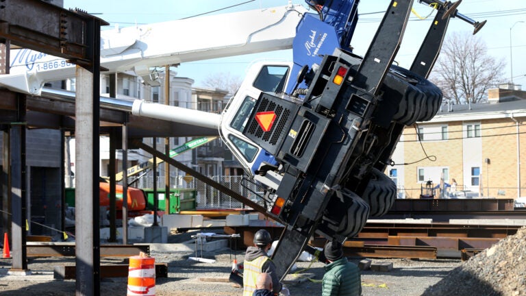 alt = a toppled over crane in Chelsea.