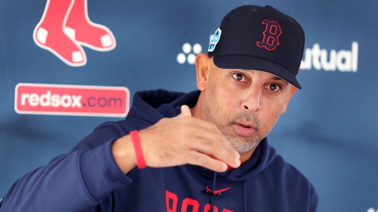 Red Sox manager Alex Cora is pictured as he answers questions from reporters. Some members of the Boston Red Sox practiced today in preparation for tomorrow’s first official workout of Spring Training at their Fenway South Complex.