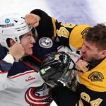 Columbus Billy Sweezey fights with Bruins Jakub Lauko in the 2nd period.