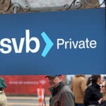 Customers lined up Monday at the Silicon Valley Bank branch in Wellesley.