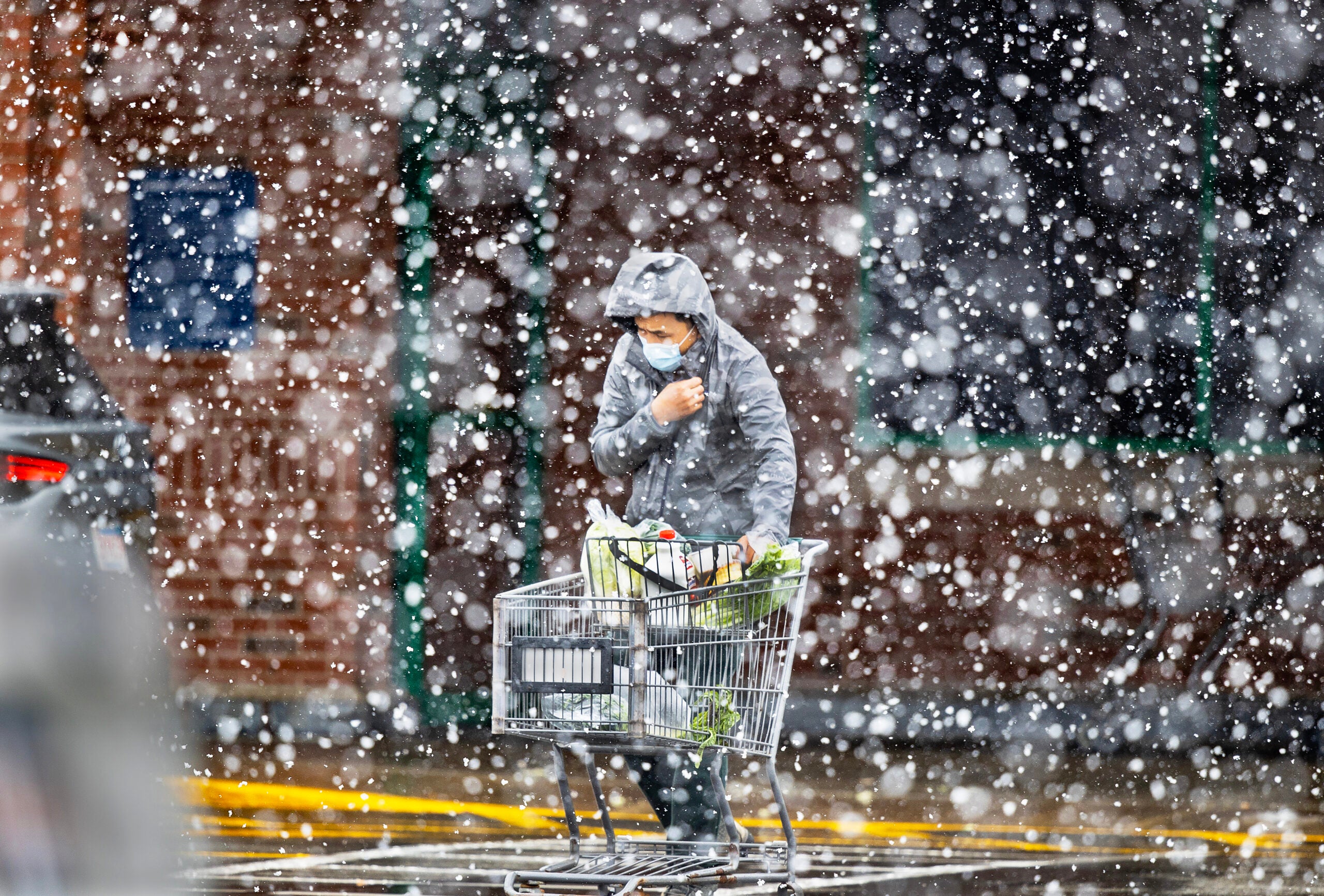 A snow squall pummels a shopper