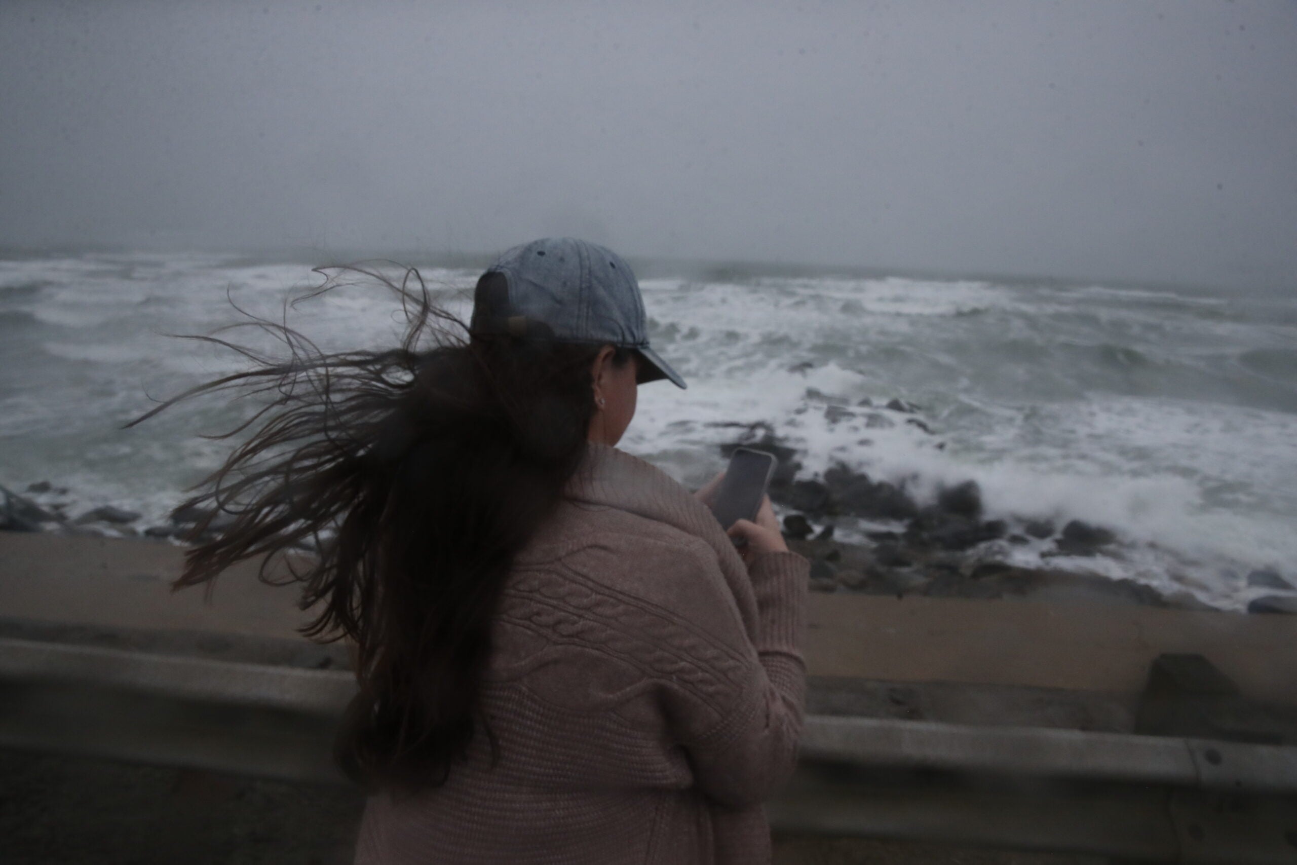 Taking photos of the surf at the seawall in Marshfield.