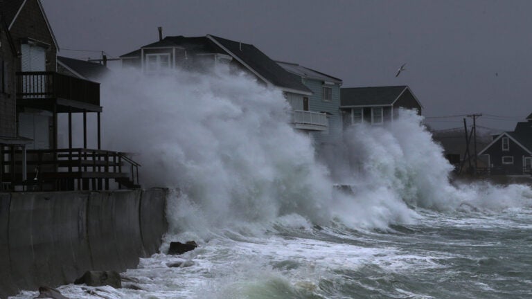 Waves crash into homes on Turner Road in Scituate.