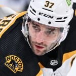 Patrice Bergeron #37 of the Boston Bruins waits for the puck drop during the first period against the Montreal Canadiens at Centre Bell on April 13, 2023 in Montreal, Quebec, Canada. The Boston Bruins defeated the Montreal Canadiens 5-4.