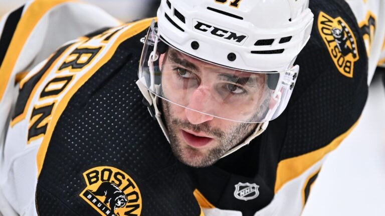 Patrice Bergeron doesn't travel with Bruins for games in Florida