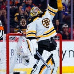 Boston Bruins' Jeremy Swayman celebrates the win following the third period of an NHL hockey game against the Philadelphia Flyers, Sunday, April 9, 2023, in Philadelphia. The Bruins won 5-3.