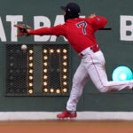 Red Sox Masataka Yoshida tries to get his glove on a double