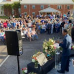 A pastor speaks at a prayer vigil outside First Baptist Church on Sunday, April 16, 2023, in Dadeville, Ala.