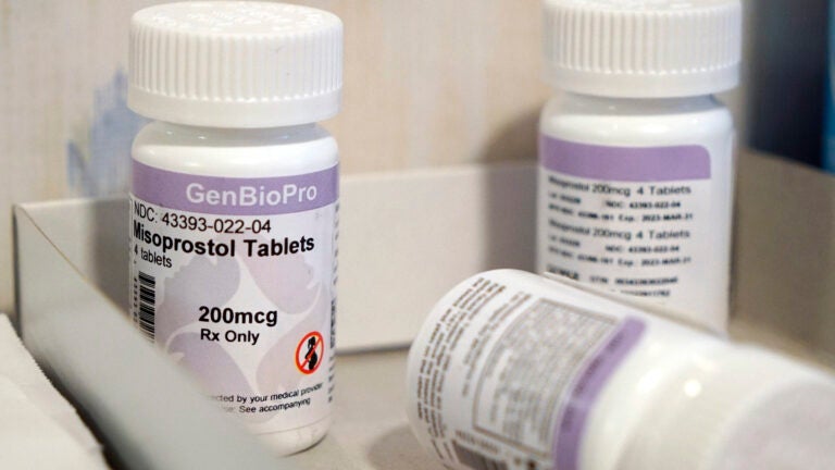 Bottles of the drug misoprostol sit on a table.