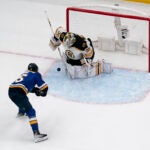 Bruins goaltender Linus Ullmark (35) stops a shot from St. Louis Blues' Jakub Vrana.
