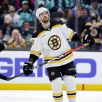 Boston Bruins center David Krejci (46) skates on the ice looking up to the scoreboard after scoring against the Seattle Kraken during the first period of an NHL hockey game, Thursday, Feb. 23, 2023, in Seattle.
