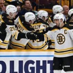 Boston Bruins center Patrice Bergeron (37) is congratulated after scoring a goal against the Nashville Predators during the second period of an NHL hockey game Thursday, Feb. 16, 2023, in Nashville, Tenn.
