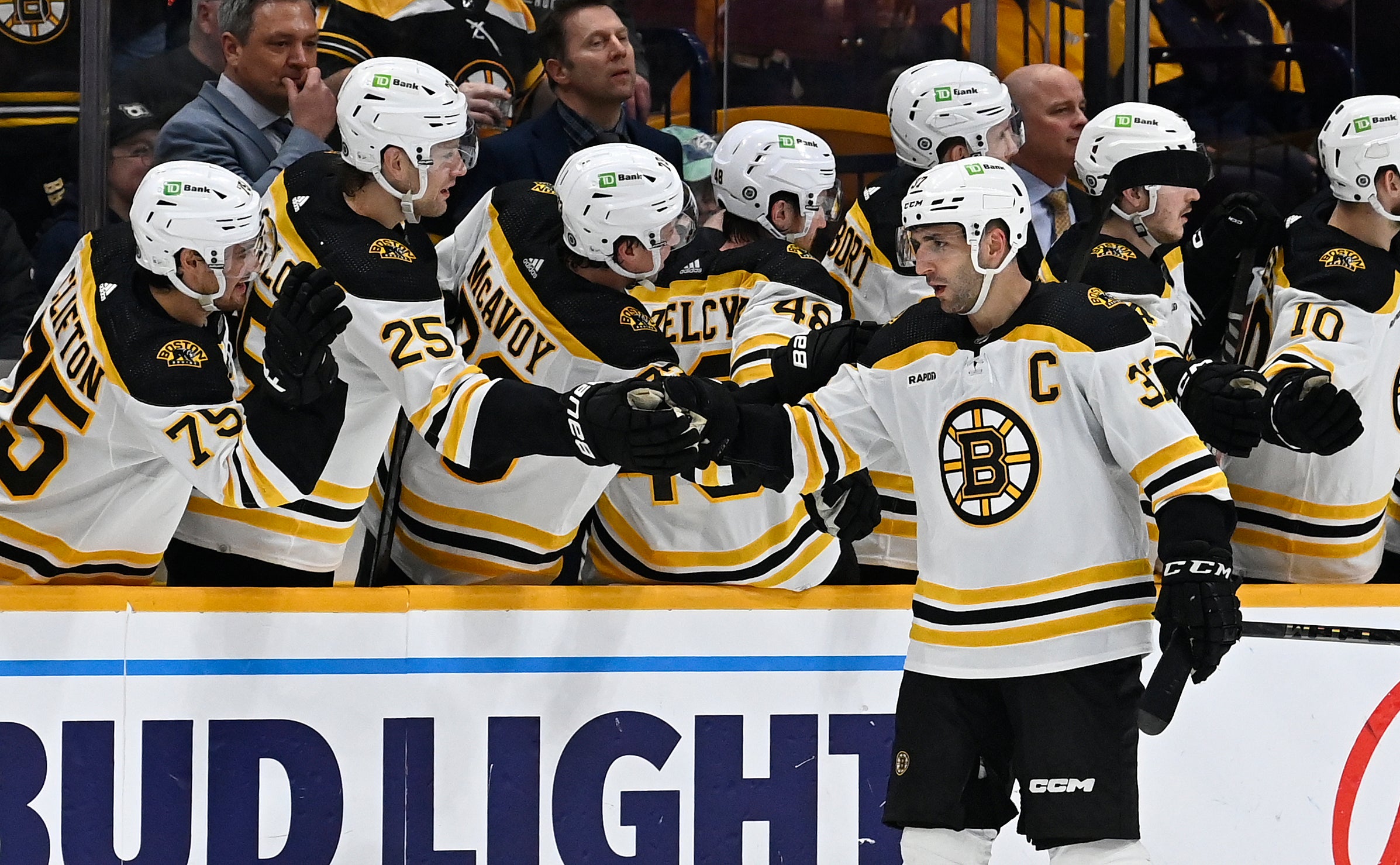 Boston Bruins center Patrice Bergeron (37) is congratulated after scoring a goal against the Nashville Predators during the second period of an NHL hockey game Thursday, Feb. 16, 2023, in Nashville, Tenn.